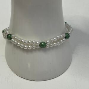 white faux pearl bracelet with green beads in silver tone setting w barrel clasp
